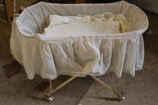 Victorian painted metal dolls bassinet with wheeled frame